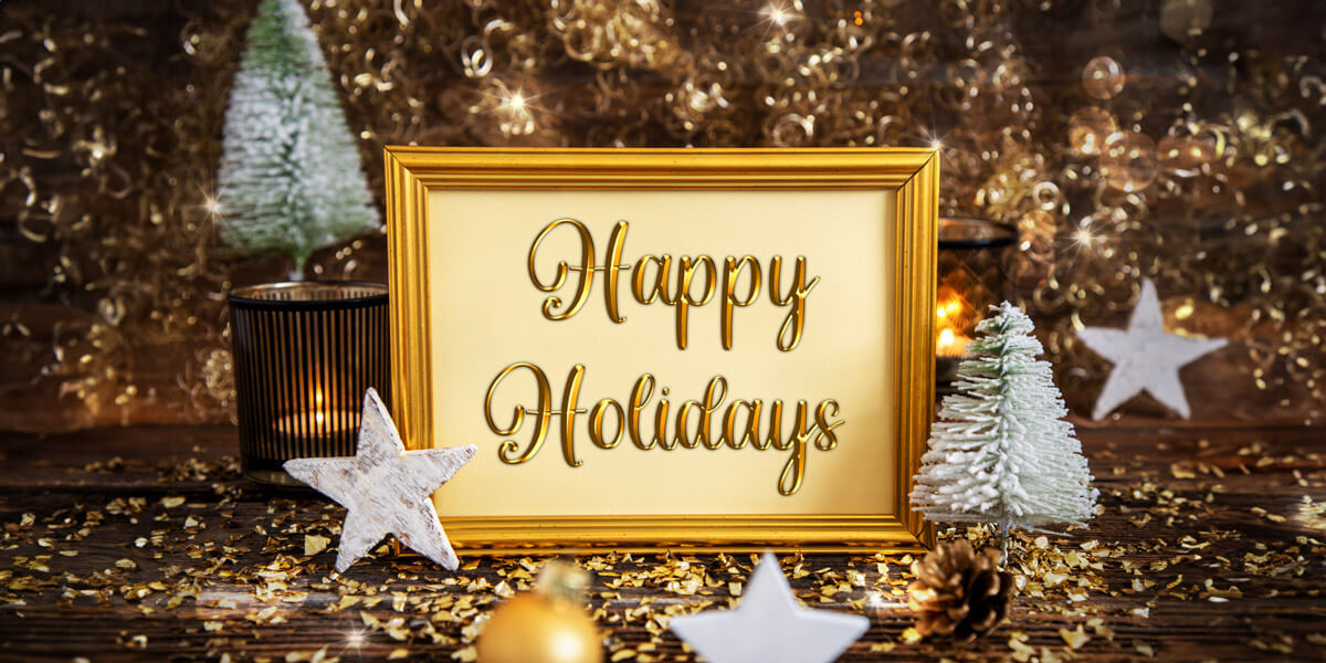 Happy holidays text on wooden background, with a warm and festive atmosphere.