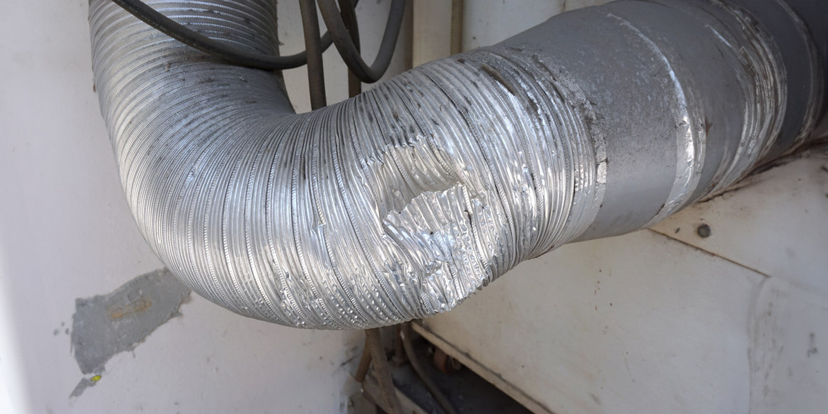Close-up image of metal pipe showing hole.